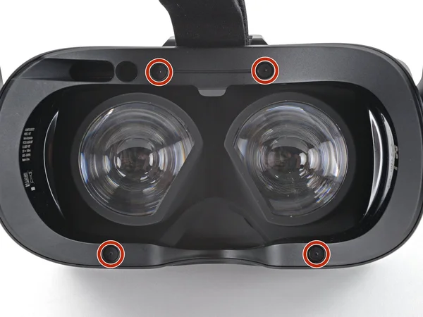 Keturi T5 Torx varžtai pažymėti ant ausinių