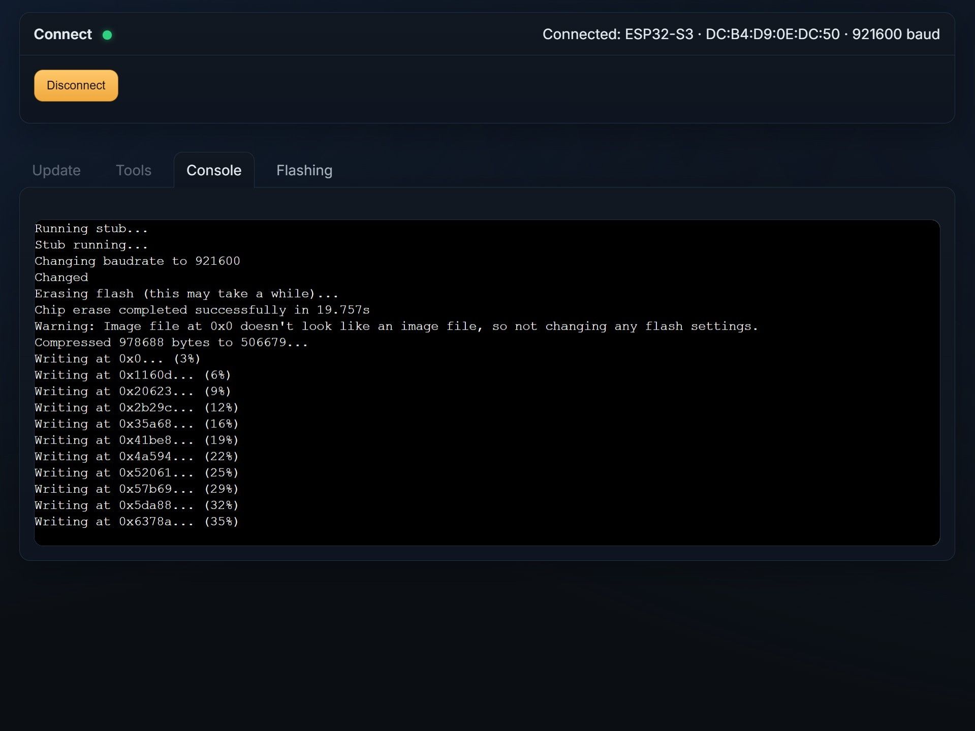 Console output showing the firmware flash progress continuing
